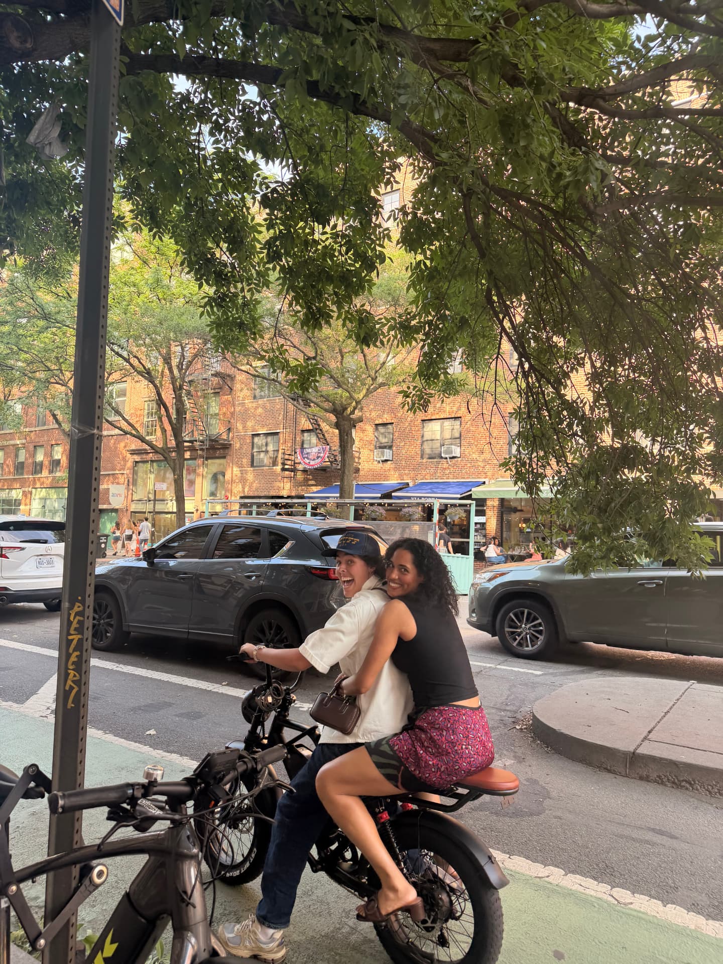 Maddie riding an e-bike in Brooklyn