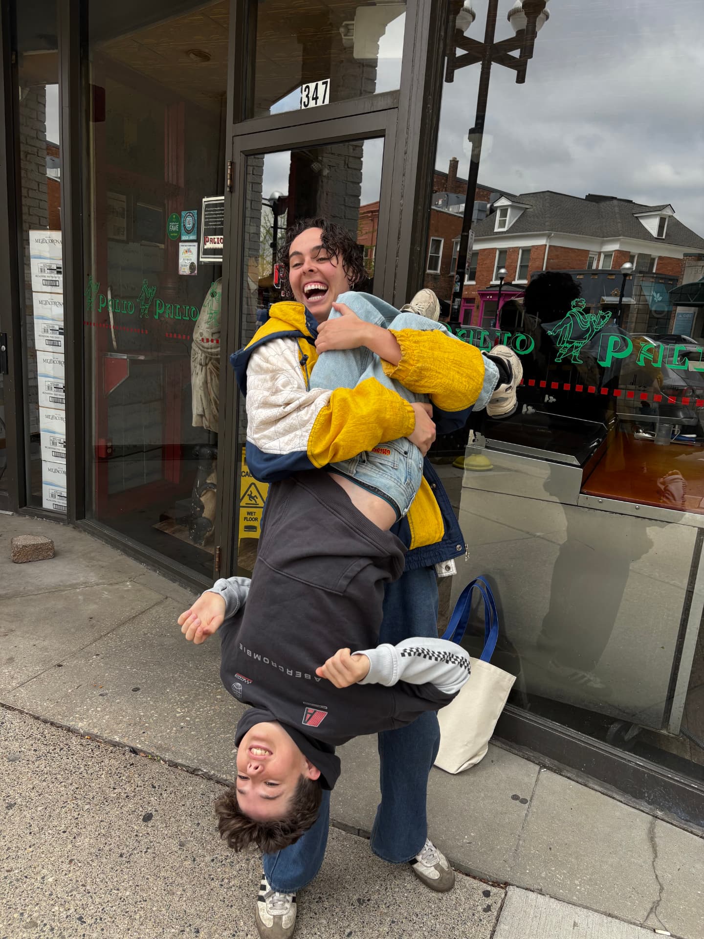Maddie laughing with one of her younger brothers